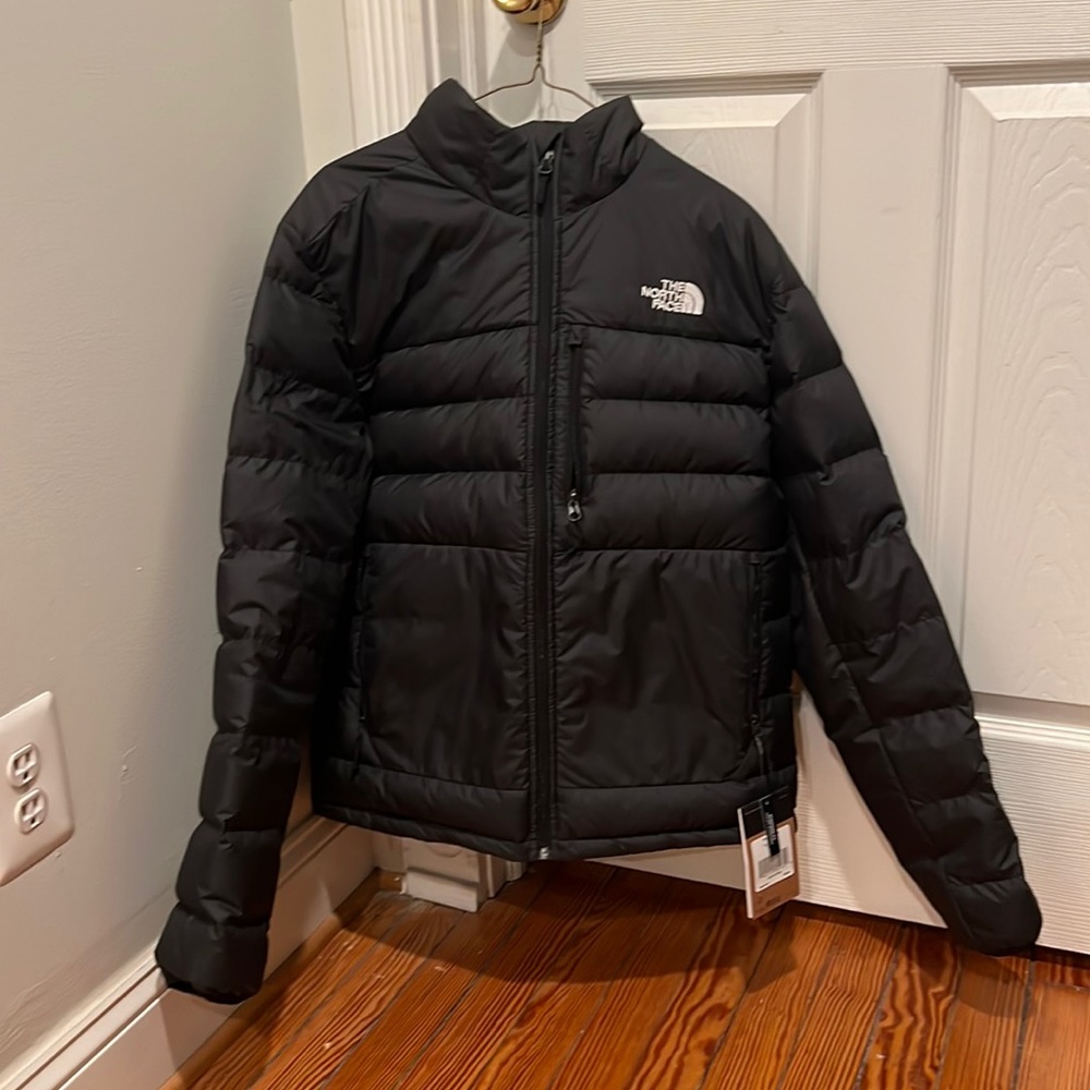 Black North Face puffer jacket.